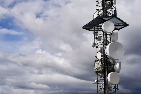 telecommunications-towers-against-cloudy-sky telecommunications-towers-against-cloudy-sky